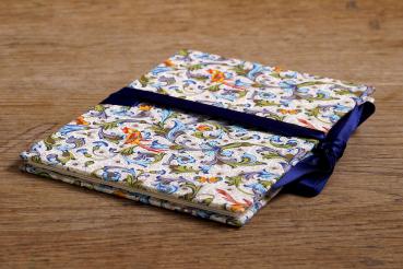 Mini photo album with colorful Florentine paper and blue ribbon to tie